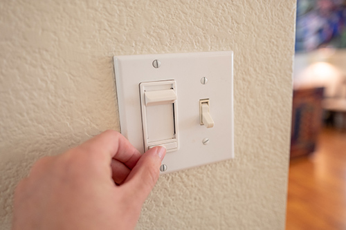 POV Man Adjusting Dimmer Switch